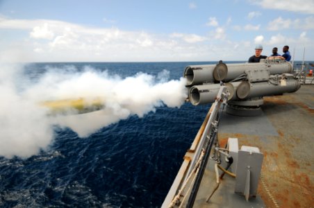 US Navy 110822-N-XQ375-561 Sailors observe a MK-46 recoverable exercise torpedo launch during a weapons exercise aboard the guided-missile destroye