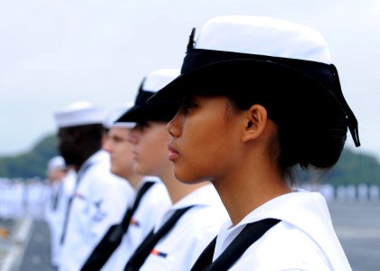 US Navy 110825-N-DS193-004 Aviation Boatswain's Mate Airman Fergy Novo and Sailors aboard USS George Washington (CVN 73) man the rails as the ship