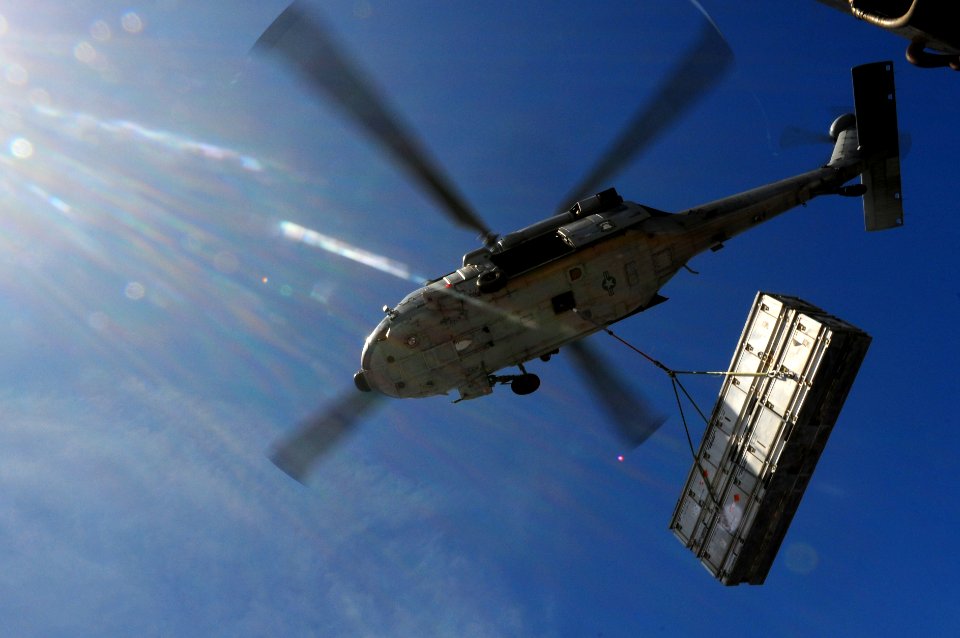 US Navy 110828-N-UO379-179 An MH-60S Sea Hawk helicopter transports ordnance from USS Ronald Reagan (CVN 76) to USNS Charles Drew (T-AKE 10) during