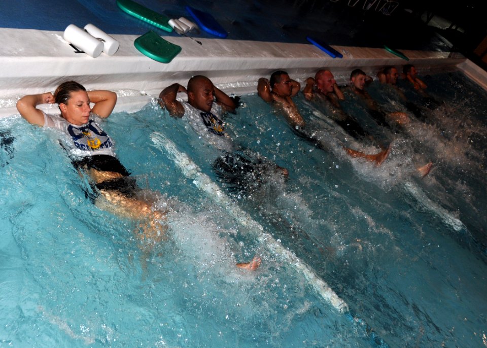 US Navy 110826-N-OH262-114 Chief petty officer selects perform exercises during physical fitness training at Naval Station Guantanamo Bay, Cuba, as