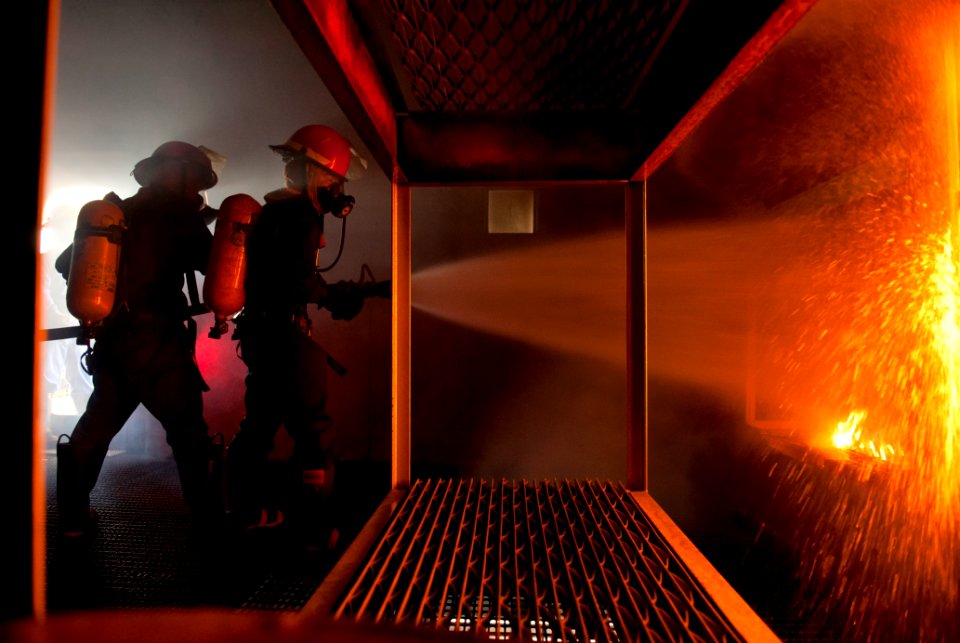 US Navy 110824-N-DR144-979 Japan Maritime Self-Defense Force sailors fight a simulated berthing fire while training at the Center for Naval Enginee