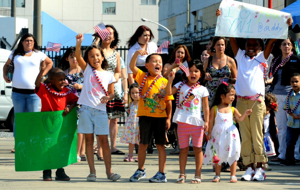 US Navy 110829-N-XG305-375 Families of Sailors assigned to USS Blue Ridge (LCC 19) cheer their arrival at Commander, Fleet Activities Yokosuka