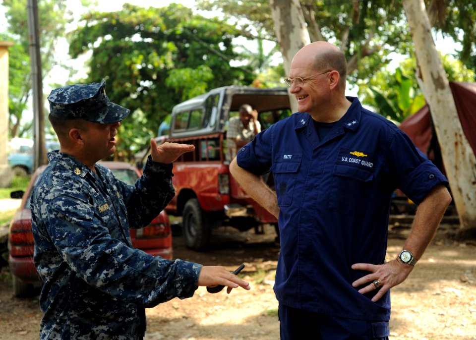 US Navy 110828-N-NY820-122 Rear Adm. Steven Ratti visits with Chief Hospital Corpsman Eric Davenport at a temporary medical site at the Killick Coa