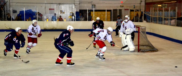 US Navy 110828-N-RI884-158 Members of the Navy, Marine Corps, and Coast Guard hockey team, in blue, and the Air Force and Army team participate in