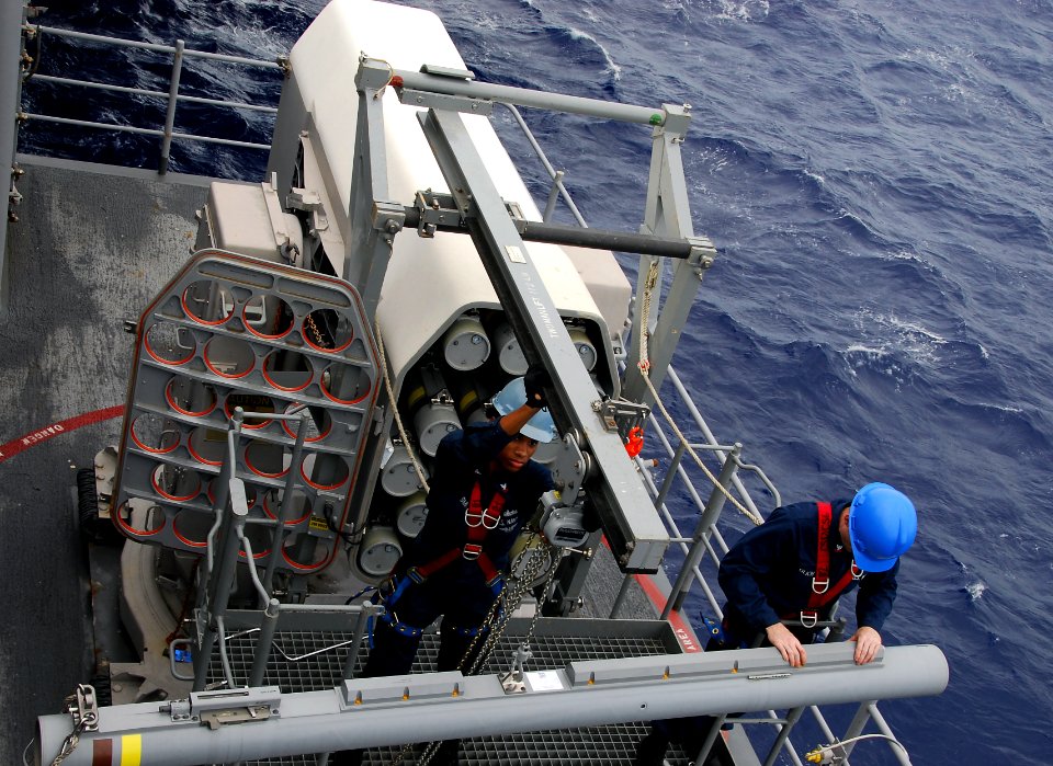 US Navy 110826-N-KF029-057 Fire Controlmen transfer missiles from a Nato Sea Sparrow Missile System during a weapons movement evolution aboard the