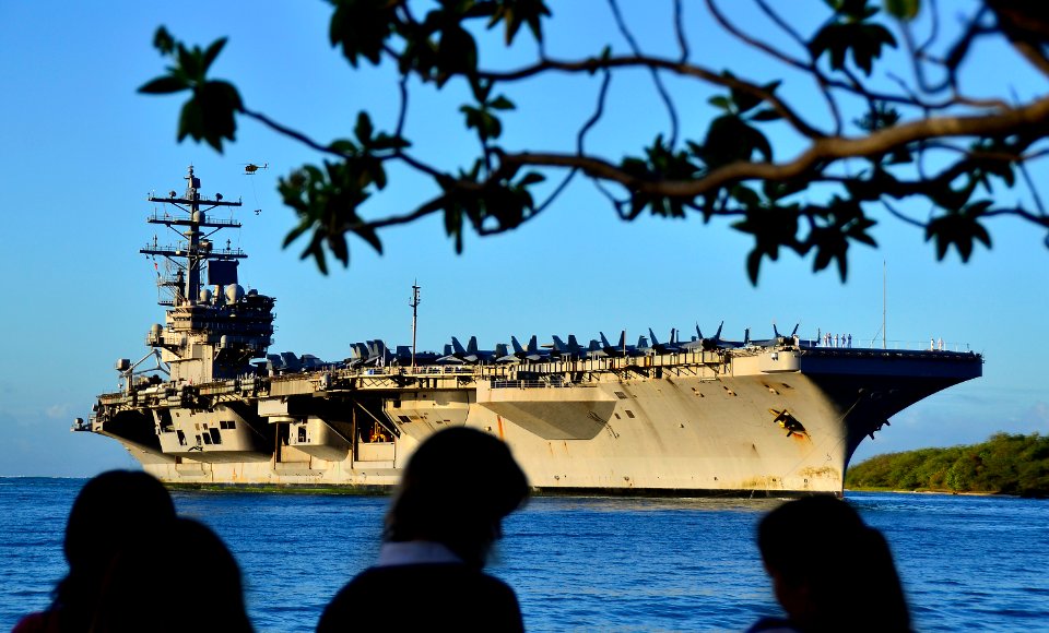 US Navy 110831-N-RI844-023 Friends and family members of Sailors aboard the Nimitz-class aircraft carrier USS Ronald Reagan (CVN 76) watch the ship