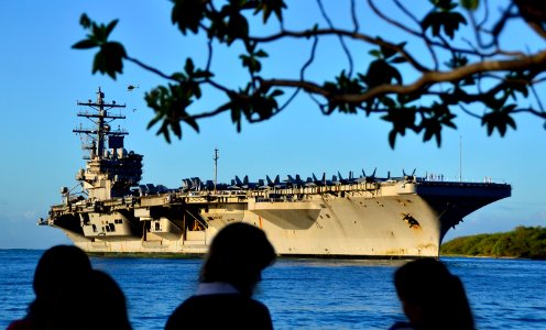 US Navy 110831-N-RI844-023 Friends and family members of Sailors aboard the Nimitz-class aircraft carrier USS Ronald Reagan (CVN 76) watch the ship photo