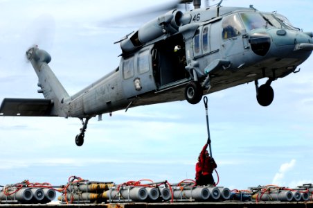 US Navy 110828-N-SB672-226 An MH-60S Sea Hawk helicopter assigned to the Wild Cards of Helicopter Sea Combat Squadron (HSC) 23 lifts a pallet of or