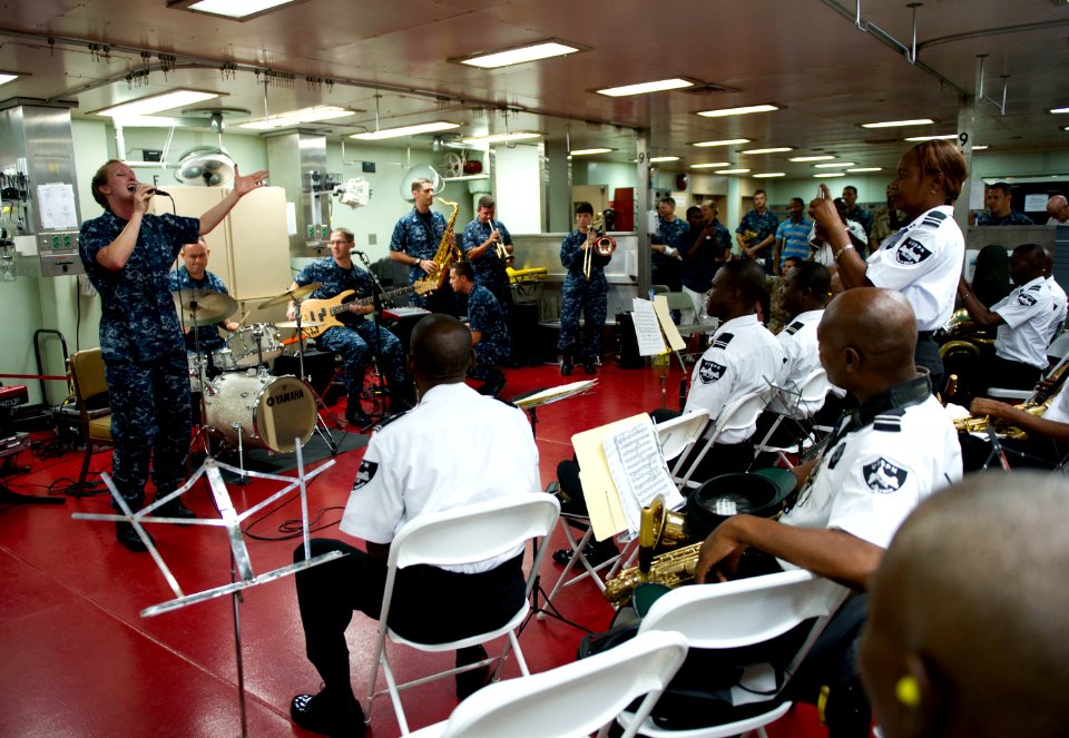 US Navy 110829-N-RM525-014 The U.S. Fleet Forces Band performs for the Haitian Police Band aboard USNS Comfort (T-AH 20) during Continuing Promise