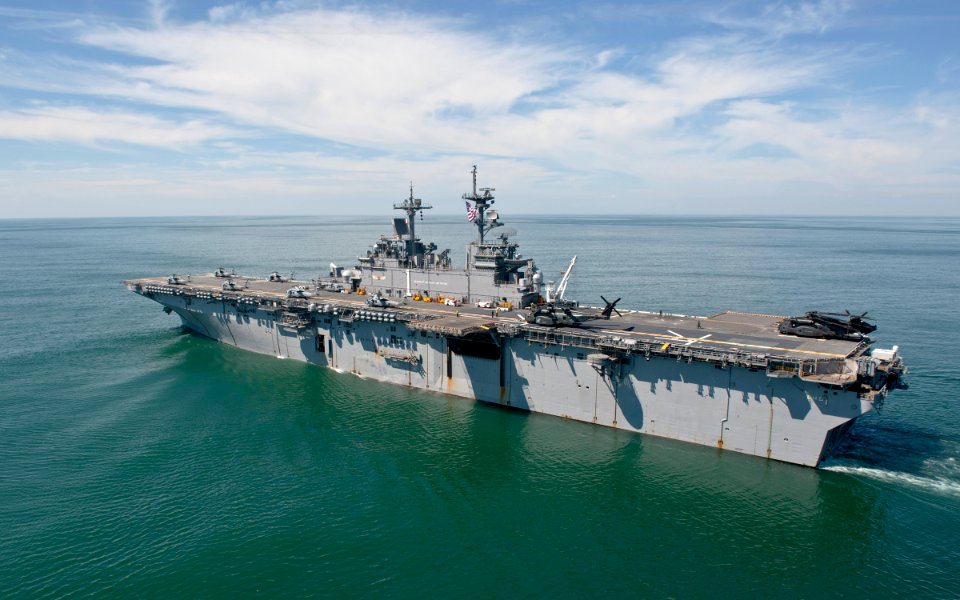 US Navy 110831-N-PM781-001 MH-60S Sea Hawk helicopters and MH-53 Sea Dragon helicopters prepare to launch from USS Wasp (LHD 1)