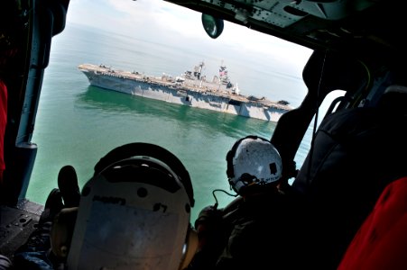 US Navy 110831-N-PM781-004 The aircrew aboard an MH-60S Sea Hawk helicopter view USS Wasp (LHD 1) while in flight