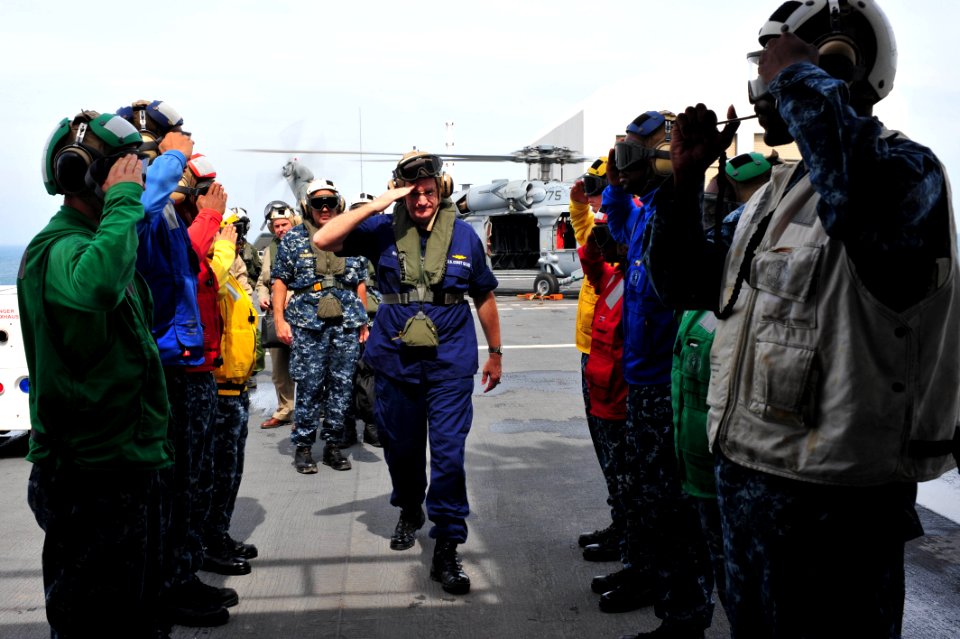 US Navy 110828-F-NJ219-023 Rear Adm. Steven Ratti salutes sideboys as he embarks USNS Comfort (T-AH 20) for a tour during Continuing Promise 2011