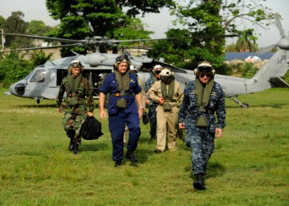 US Navy 110828-N-NY820-048 Rear Adm. Steven Ratti arrives by helicopter at a temporary medical site at the Killick Coast Guard Base in Port-au-Prin