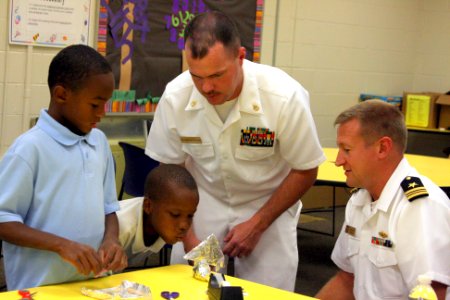US Navy 110830-N-NT881-075 Sailors elp Taft Elementary School students learn the principles of buoyancy and sail design through the Science, Techno