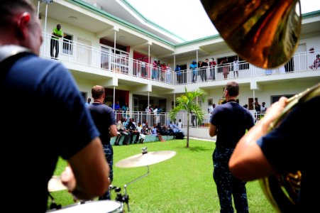 US Navy 110828-N-QD416-161 U.S. Fleet Forces Band members perform for patients at St. Damien Hospital during the final mission supporting Continuin photo