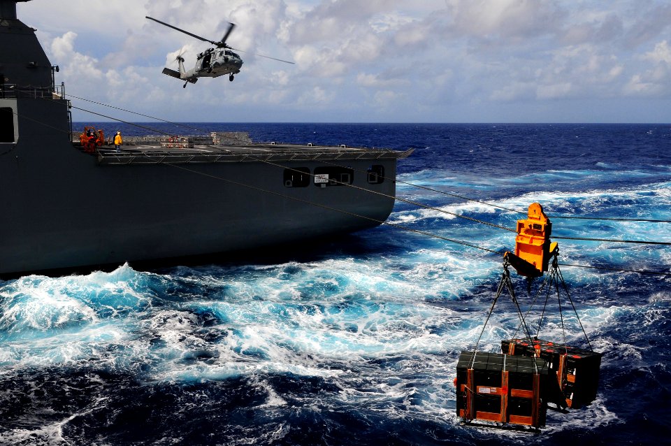 US Navy 110828-N-UO379-055 An MH-60S Sea Hawk helicopter transports ordnance from USS Ronald Reagan (CVN 76) to USNS Charles Drew (T-AKE 10) during