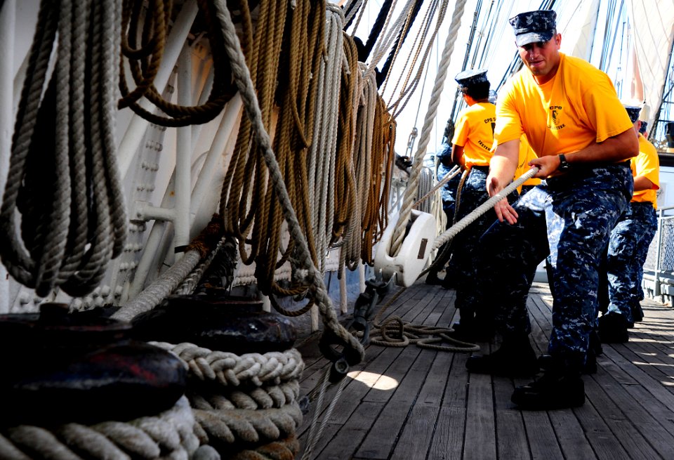 US Navy 110829-N-KB563-214 Chief (select) Aviation Ordnanceman heaves a line aboard the sailing ship Star of India, part of the San Diego Maritime