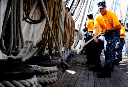 US Navy 110829-N-KB563-214 Chief (select) Aviation Ordnanceman heaves a line aboard the sailing ship Star of India, part of the San Diego Maritime