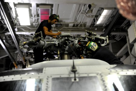 US Navy 110831-N-YZ751-219 Aviation Machinist's Mate 2nd Class Eric A. Acosta, left, and Aviation Machinist's Mate 3rd Class Fred M. Baxter