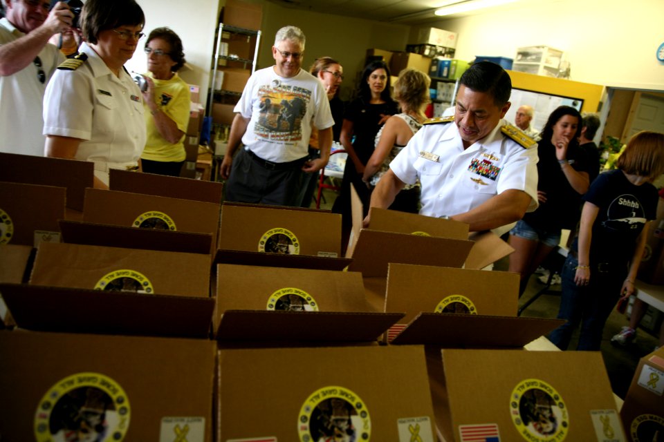 US Navy 110901-N-YM440-162 Rear Adm. Anatolio B. Cruz III visits the Yellow Ribbon Support Center where local Sailors prepared care packages for se
