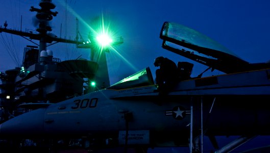 US Navy 110902-N-GC412-166 Aviation Structural Mechanic Airman Samantha Guay conducts maintenance on an F-A-18C Hornet aboard USS John C. Stennis (