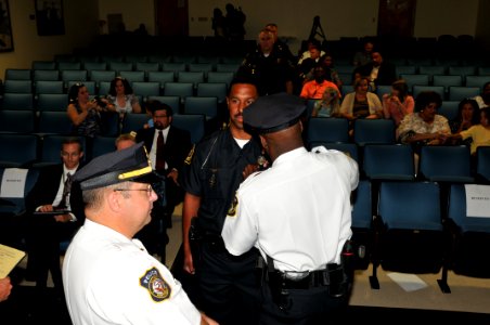 US Navy 110902-N-NL541-028 Cadet Brian Washington, center, graduates from Commander, Navy Region Mid-Atlantic Regional Training Academy at Joint Ex