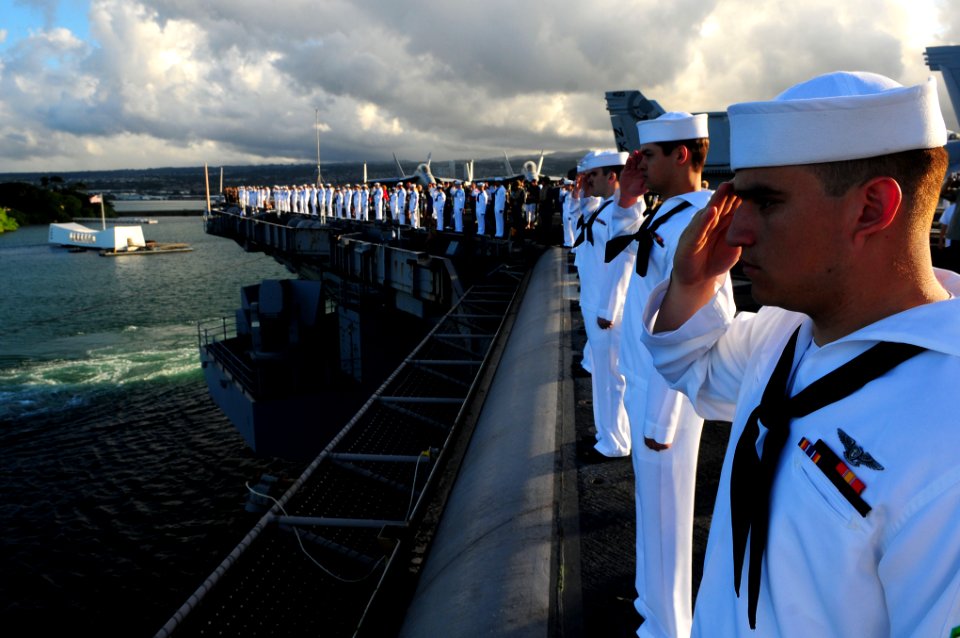US Navy 110903-N-UO379-257 Sailors and Marines render honors as USS Ronald Reagan (CVN 76) passes the USS Arizona Memorial while departing Pearl H