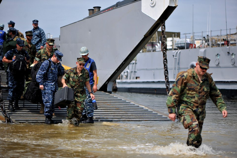 US Navy 110902-N-YO394-133 Sailors assigned to Navy Expeditionary Combat Command's adaptive force package disembark a landing craft utility a
