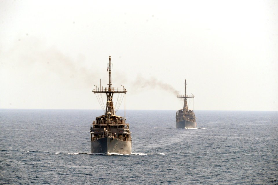 US Navy 110830-N-YZ751-288 The mine countermeasure ships USS Scout (MCM 8), left, and USS Gladiator (MCM 11), transit the Strait of Hormuz