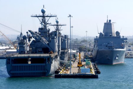 US Navy 110831-N-ZC343-617 The amphibious dock landing ships USS Pearl Harbor (LSD 52) and USS Rushmore (LSD 47) share a pier with the amphibious t
