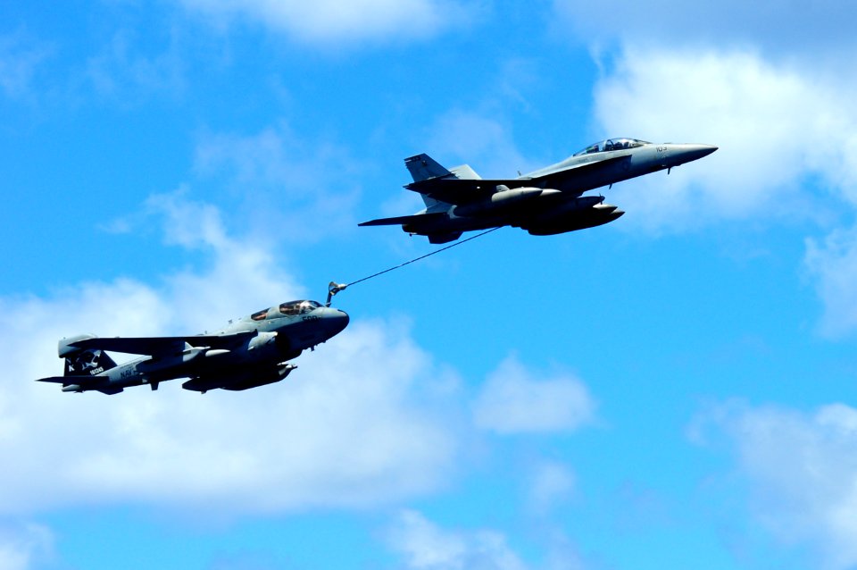 US Navy 110904-N-UO379-071 An EA-6B Prowler and an F-A-18F Super Hornet demonstrate a mid-air refueling evolution as they fly near USS Ronald Reaga