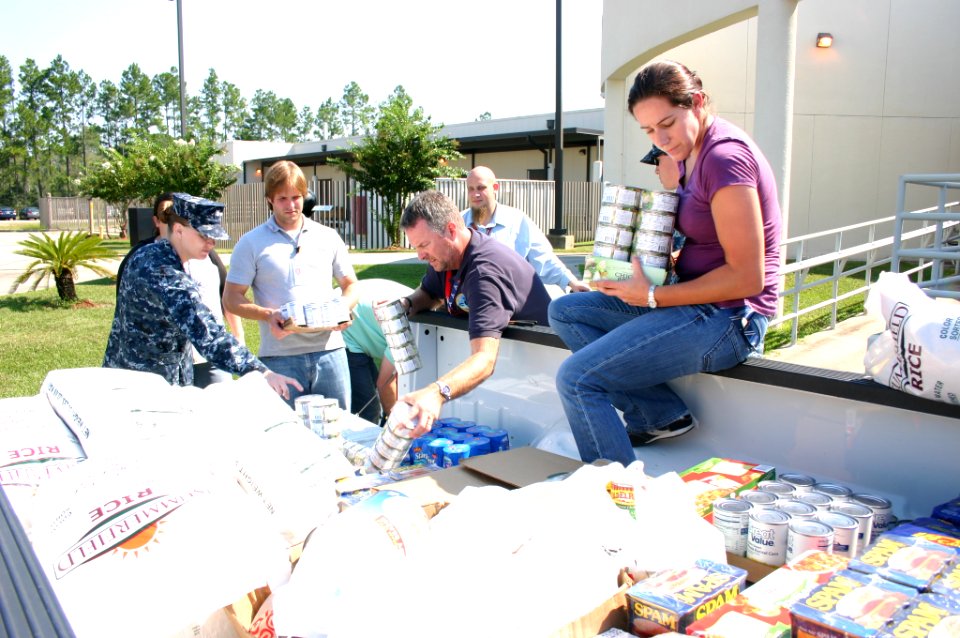 US Navy 110831-N-UT935-575 Civilians and Sailors assigned to the John C. Stennis Space Center load nearly a ton of food