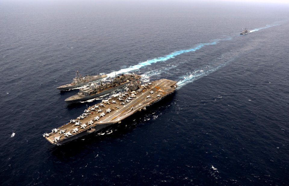 US Navy 110830-N-ZZ999-971 The Military Sealift Command fast combat support ship USNS Rainier (T-AOE 7), middle, conducts an underway replenishment