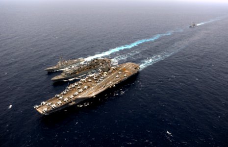 US Navy 110830-N-ZZ999-971 The Military Sealift Command fast combat support ship USNS Rainier (T-AOE 7), middle, conducts an underway replenishment