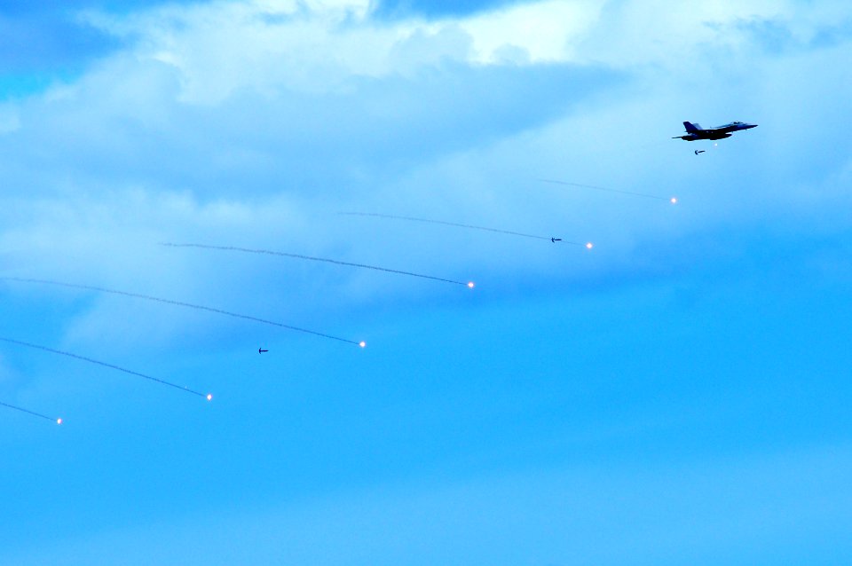US Navy 110904-N-UO379-132 An F-A-18C Hornet releases training ordnance near USS Ronald Reagan (CVN 76) during a tiger cruise