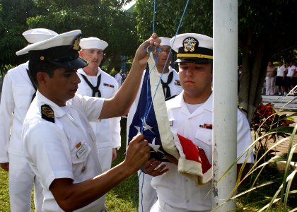 US Navy 110901-N-ZI300-037 El Salvadorian navy Sgt. 1st Class Jose Recinos and Ensign David Lovejoy, assigned to the guided-missile frigate USS Tha