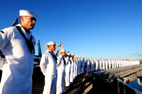 US Navy 110831-N-NB544-106 Sailors and Marines man-the-rails aboard the aircraft carrier USS Ronald Reagan (CVN 76) while entering Pearl Harbor for photo