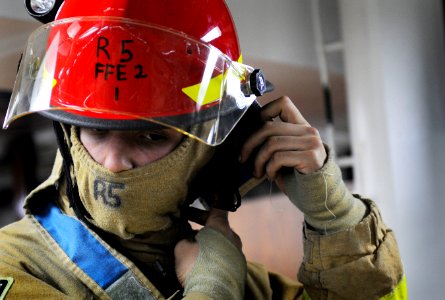 US Navy 110905-N-OK922-370 A Sailor checks his flash gear during a general quarters drill aboard the Nimitz-class aircraft carrier USS Carl Vinson