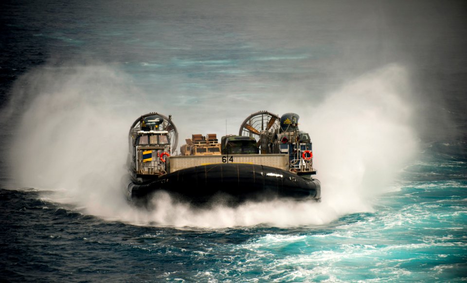 US Navy 110904-N-PB383-345 A landing craft air cushion (LCAC) approaches the amphibious transport dock ship USS New Orleans (LPD 18)