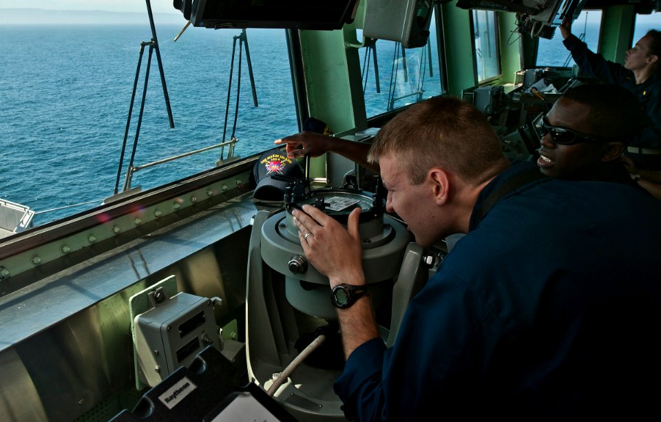 US Navy 110906-N-DX615-082 Sailors study navigation procedures during a strait transit navigation exercise