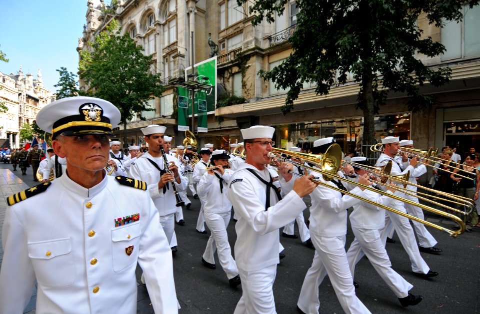 US Navy 110903-N-AQ172-270 Lt. Cmdr. Kenneth Collins, left, music director of the Commander, U.S. Naval Forces Europe Band, leads the band in a par