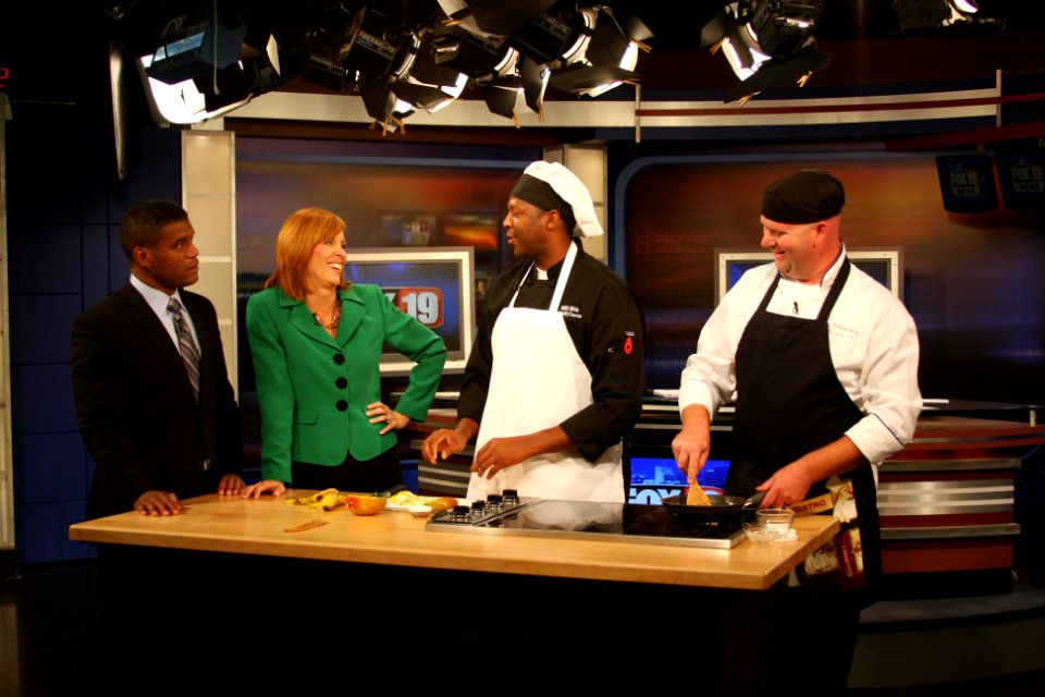 US Navy 110902-N-NT881-095 Navy Culinary Specialist 1st Class Antonio Thomas, left, and Navy Culinary Specialist 1st Class Andrew Purdy perform a c