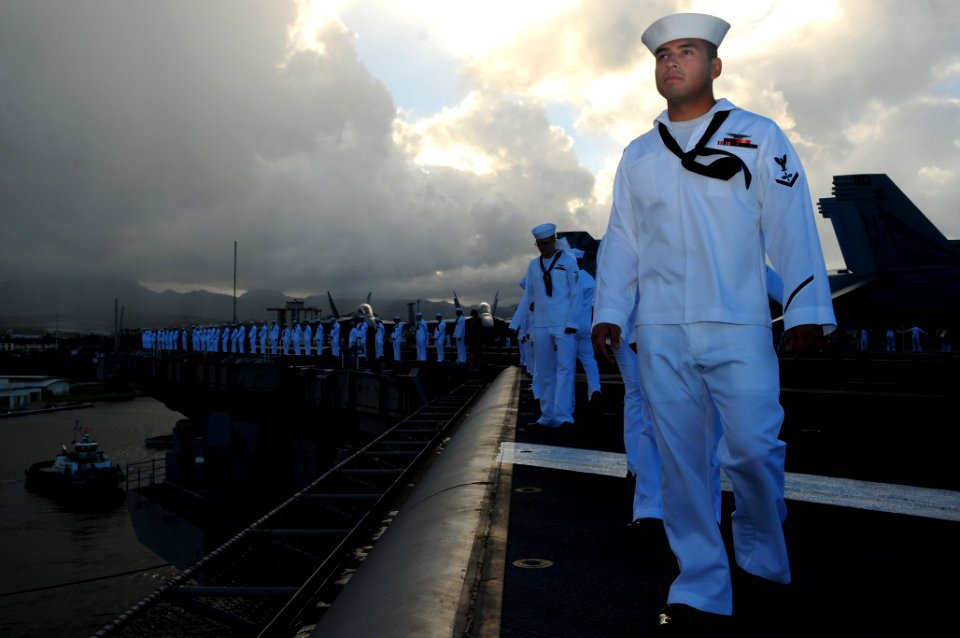 US Navy 110903-N-UO379-143 Sailors and Marines man the rails aboard USS Ronald Reagan (CVN 76) before departing Pearl Harbor