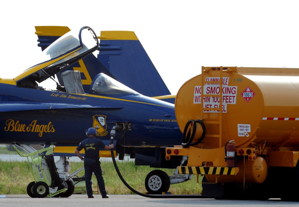 US Navy 110903-N-KV696-080 members of the ground crew of the U.S. Navy flight demonstration squadron, the Blue Angels, fuel an F-A-18 during the Na
