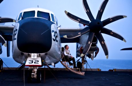 US Navy 110902-N-GC412-198 Aviation Structural Mechanic 3rd Class John Coughlin relaxes for a moment on a C-2A Greyhound aboard USS John C. Stennis