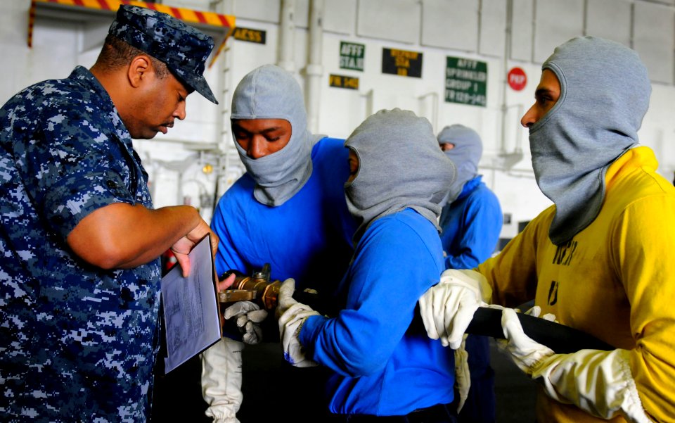 US Navy 110905-N-OK922-058 Sailors participate in a simulated fire drill aboard the Nimitz-class aircraft carrier USS Carl Vinson (CVN 70)