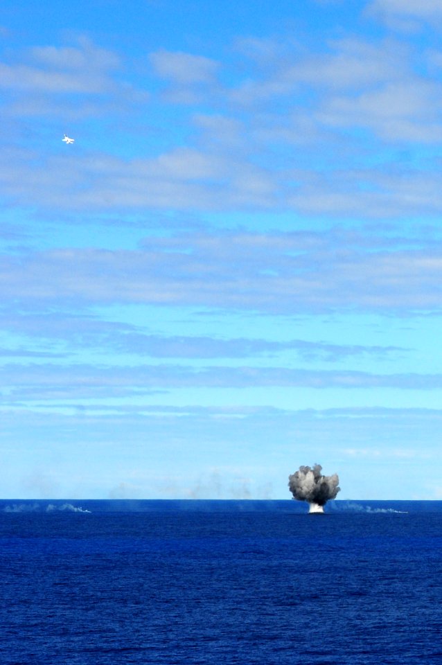 US Navy 110905-N-UO379-428 An F-A-18E Super Hornet accelerates away from a 500-pound bomb detonation during a tiger cruise air show aboard USS Rona