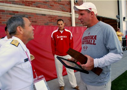 US Navy 110906-N-CI293-159 Rear Adm. Douglas J. McAneny, commandant of the National War College, presents University of Nebraska Head Football Coac