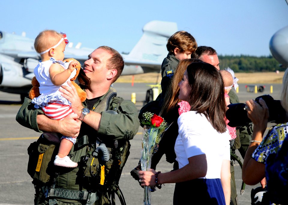 US Navy 110907-N-ZK021-003 Lt. Chris Ritter is greeted by family members during a homecoming ceremony at Naval Air Station Whidbey Island following