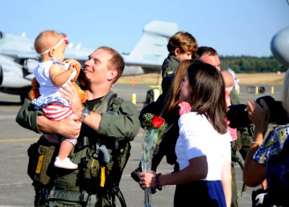 US Navy 110907-N-ZK021-003 Lt. Chris Ritter is greeted by family members during a homecoming ceremony at Naval Air Station Whidbey Island following
